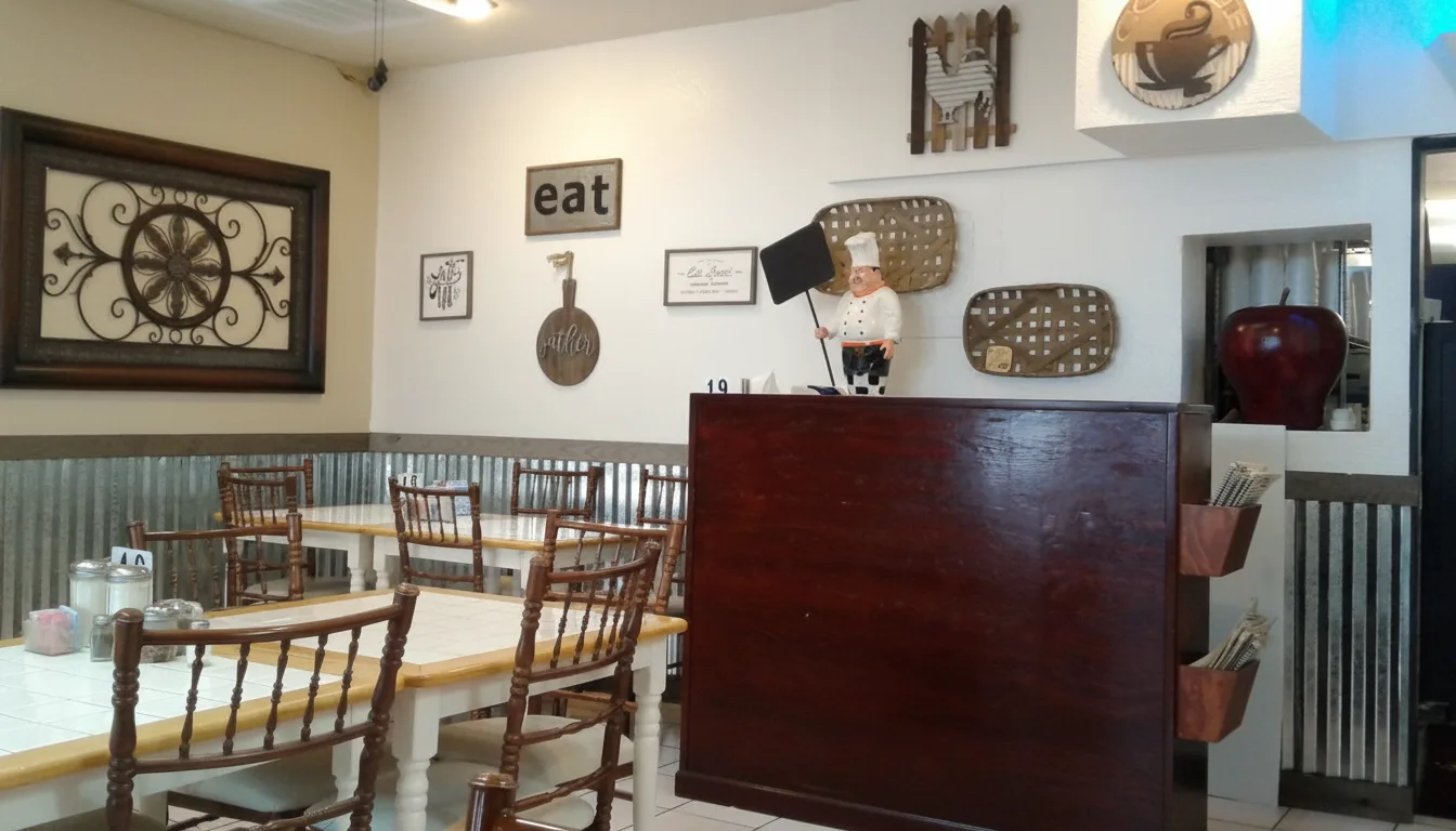 The dining room with wooden chairs and the eat sign